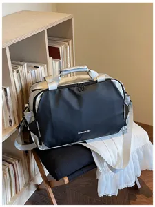 Stylish color-block travel duffel bag with shoulder strap for gym, commute, and weekend trips.