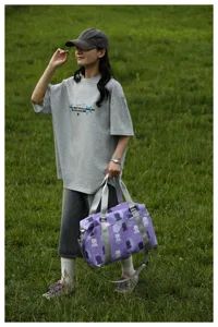 Cute bear print travel duffel bag for women, stylish shoulder luggage bag for weekend trips.