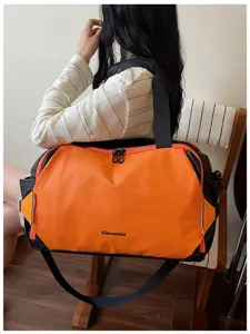 Stylish color-blocking travel duffel bag with durable shoulder strap for gym and short trips.
