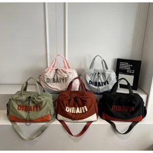 Fashionable travel duffel bag with contrast color design, large capacity and shoulder strap.