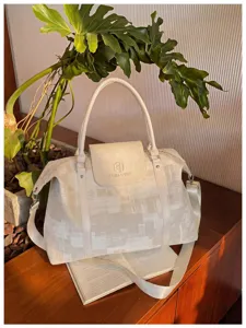Detailed view of the stylish oil painting pattern travel duffel bag with shoulder strap.
