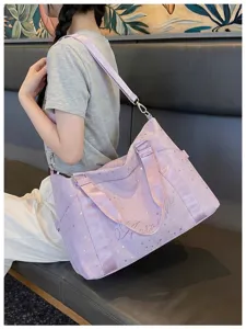 Stylish purple starry travel duffel bag with shoulder strap for daily gym and weekend trips.