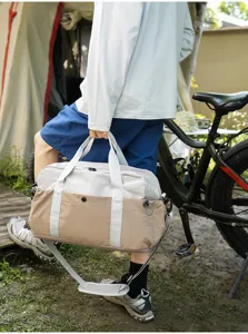 Color-blocked duffel bag for short trips, outdoor travel, camping, and portable luggage storage.