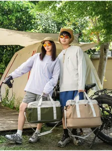 Color-blocked outdoor travel duffel bag with shoulder strap for camping and short trips.