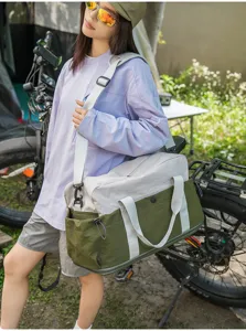 Color-blocked duffel travel bag for outdoor camping, stylish shoulder luggage bag with straps.