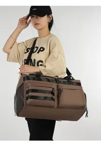 Grand sac de voyage fourre-tout multifonctionnel avec plusieurs poches et compartiment.