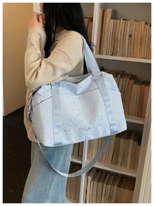 Stylish light blue star print travel shoulder bag, large capacity daily commuter gym duffel bag.