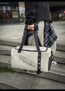 Large capacity travel duffel bag with durable fabric, sturdy handles and side mesh pockets.
