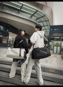 Outdoor scene featuring large capacity travel duffel bag with convenient gym daily use design.