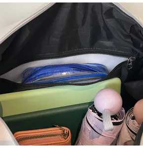Detail shot of travel duffel bag interior, showing wet dry separation and large capacity.