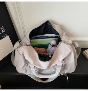 Large capacity travel duffel bag for women, waterproof gym yoga bag with wet dry separation.