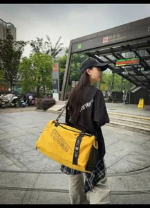Stylish yellow travel duffel bag with large capacity, perfect for gym, sports, and weekend trips.