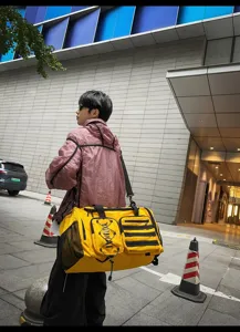 Multifunctional yellow travel duffel bag for gym, sports, and casual outdoor use. Durable.
