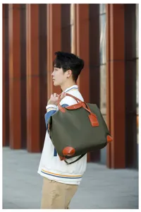 Large capacity waterproof nylon travel bag with brown leather trim for lightweight outdoor fitness.