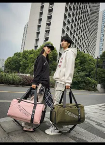 Outdoor scene showing large capacity travel duffel bags in pink and green with durable handles.