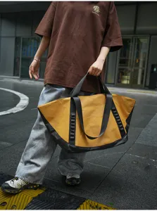 Large capacity outdoor travel tote bag with yellow and black design for daily commute and camping.