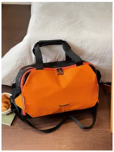 Colorblock travel duffel bag for short trips, business commuting, and gym fitness use.