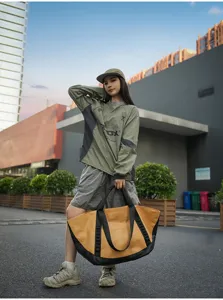 Outdoor travel duffel bag detail, large capacity canvas luggage for business commuting and camping.