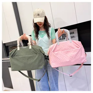 Stylish casual travel duffel bag with grid pattern and shoulder strap for fitness and daily commute.