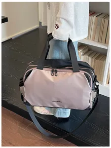 Stylish two-tone travel duffel bag for gym, weekend trips, and daily commute, spacious and durable.