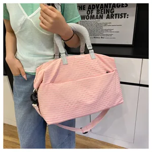 Pink plaid travel duffel bag with shoulder strap, ideal for short trips, gym and daily commuting.