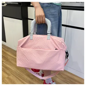 Pink checkered travel duffle bag with shoulder strap, ideal for short trips and gym use.