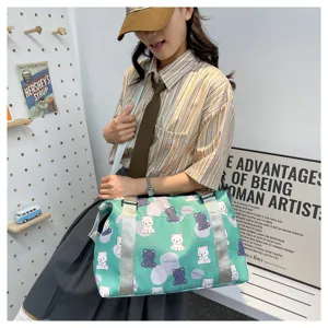 Close-up view of the cute bear print travel duffel bag showing detailed pattern fabric.