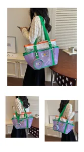 Detail view of stylish mesh tote travel bag, transparent beach shoulder bag for fitness.