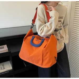 Large capacity travel duffel bag with expandable design, lightweight gym and shoulder bag for trips.