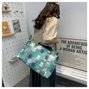 Green cute bear print travel duffel bag with wide shoulder strap for women shopping weekend trip.