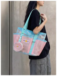 Pink and blue mesh tote bag detail showing breathable fabric, straps and attached round pouch.