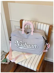 Bolsa de viaje elegante con letras para viajes cortos, bolso bandolera informal con asas rosas.