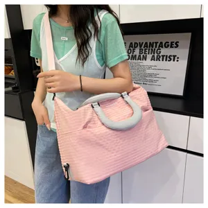 Pink plaid travel shoulder bag for women, stylish commute gym duffel bag with durable handles.