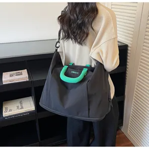 Large capacity travel duffel bag with green handle, lightweight gym and fitness messenger bag.