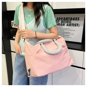 Pink plaid travel duffel bag for women, stylish shoulder crossbody bag for commute and gym fitness.