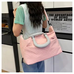 Stylish pink plaid travel bag for women, large capacity shoulder commute bag for daily use.
