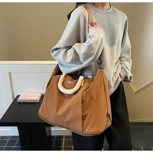 Large capacity travel duffel bag detail, expandable lightweight gym messenger bag for outdoor.