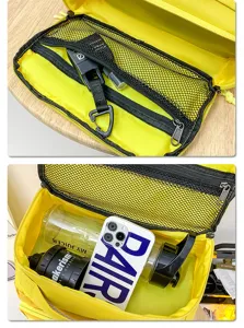 Yellow travel backpack interior detail featuring zipper mesh pocket and large main storage capacity.