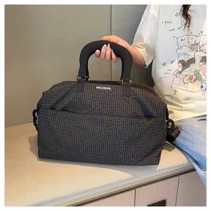 Classic plaid travel duffel bag with shoulder strap for commuting, fitness, and short trips.