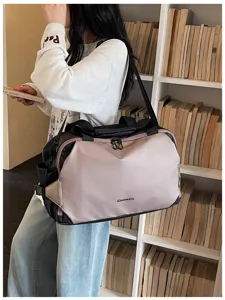 Fashionable color-blocked travel duffel bag for women, gym and casual commute shoulder bag.