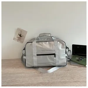 Fashionable silver grey travel duffel bag, casual shoulder fitness bag with large capacity.