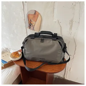 Stylish color block travel duffel bag for short trips, gym, and commute with shoulder strap