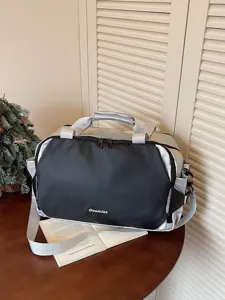 Fashion color-blocking travel duffel bag for short trips and gym, versatile casual commuter luggage.