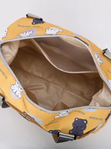 Cute bear print travel duffel bag with multiple compartments and shoulder strap for women.