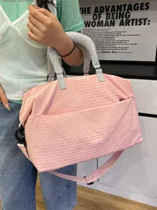 Pink plaid travel duffel bag, stylish shoulder commuter luggage bag for gym and weekend trips.