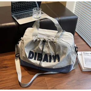 Stylish casual travel duffel bag for women and men, large capacity commuter shoulder bag.