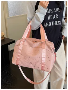 Pink star print travel duffel bag for women, stylish commuter shoulder bag and gym handbag.