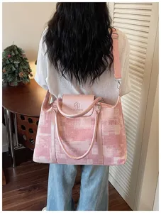 Pink geometric print travel bag, versatile shoulder bag and messenger bag for women.