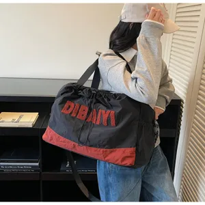 Casual black red travel shoulder bag with drawstring, stylish lightweight commuter luggage bag.