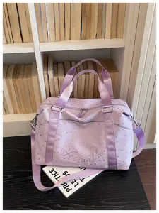 Stylish purple star print travel duffel bag with shoulder strap for women commuting daily.